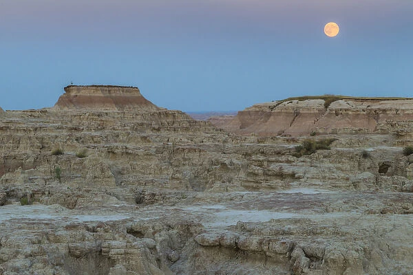 USA, South Dakota. Moonrise in Badlands National Park