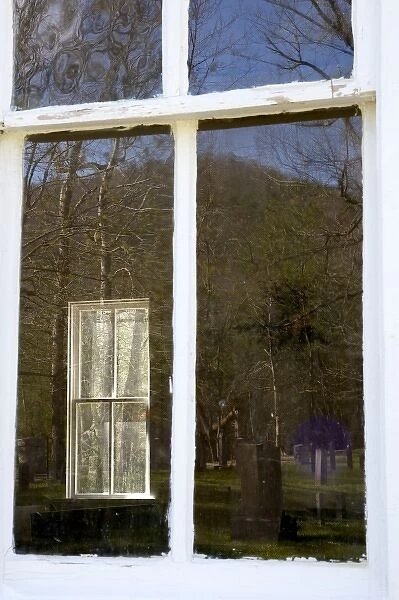 USA, Tennessee, Cades Cove. A window through a church window and a reflection of trees