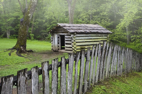 USA, Tennessee, Great Smoky Mountains National Park. Picket fence and abandoned log cabin