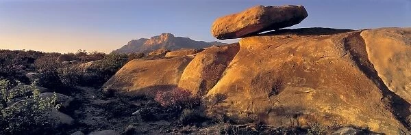 USA, Texas, Guadelupe Mountains NP. Sunset warms a balanced rock near Guadelupe Mountains