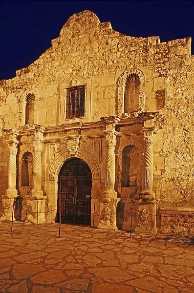 USA, Texas, San Antonio. Close-up front view of historic Alamo mission lit at night