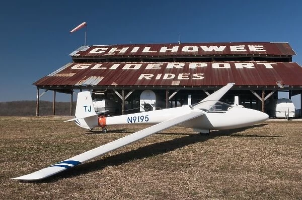 USA, TN, Chilhowee Gliderport. Fiberglass sailplane in front of barn shed. (PR)