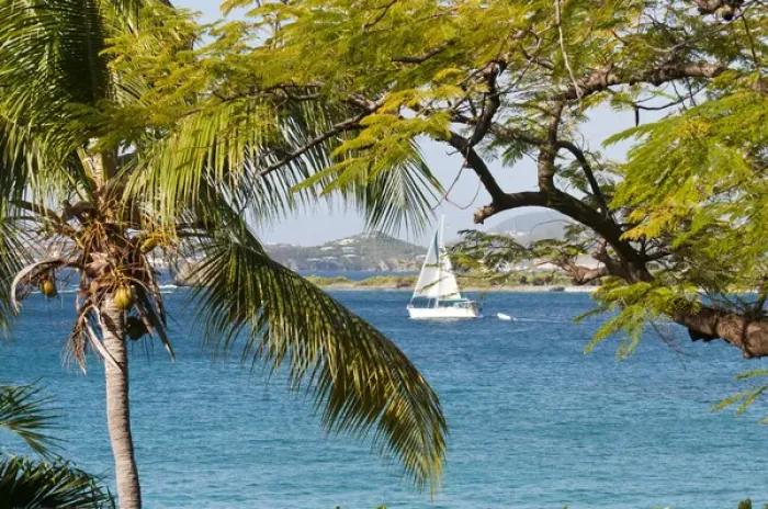 Framed Print : USA, USVI, St John. Sailboat travels between St John and Stevens Cay with St Thomas