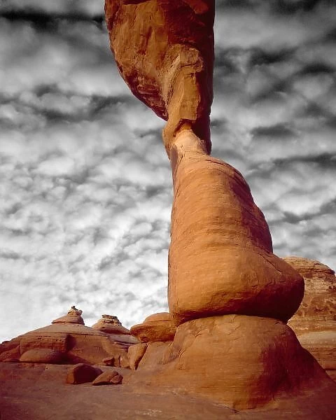 USA, Utah, Arches National Park. Portion of Delicate Arch against clouds. Credit as