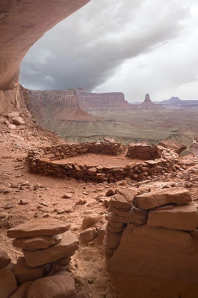 USA, Utah, Canyonlands National Park. View of Anasazi ruin with thundercloud in background