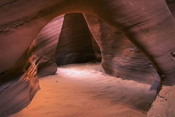 USA, Utah, Escalante Wilderness. A sandstone arch inside a slot canyon