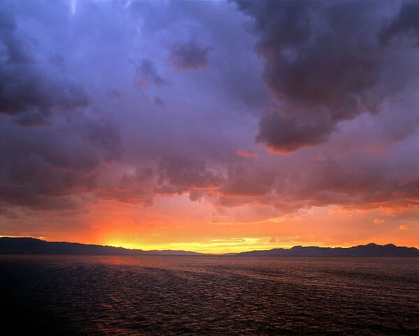 USA, Utah, Great Salt Lake. The setting sun reflects in the water of the Great Salt Lake