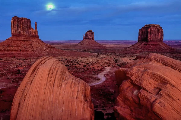 USA, Utah, Monument Valley Navajo Tribal Park. Moon and landscape of eroded formations