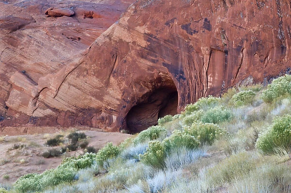 USA, Utah, Monument Valley Navajo Tribal Park. Cave in Red Rock Canyon wall. Credit as