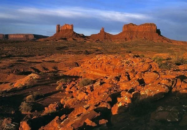 USA, Utah, Monument Valley. Sunset light throws long shadows on the buttes of Monument Valley, Utah