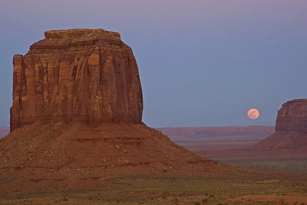 USA, Utah, Monument Valley Tribal Park. Full moon rising over Monument Valley. Credit as
