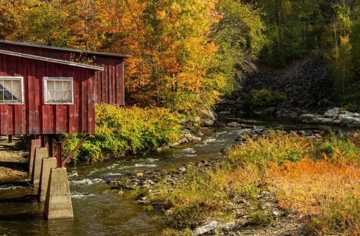 Framed Print : USA, Vermont, Stowe, red mill on Little River as it flows south of Stowe to Winooski River, fall foliage