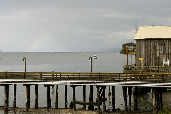 USA, WA, Island County, Whidbey Island. Rainbow over Penn Cove after storm passes