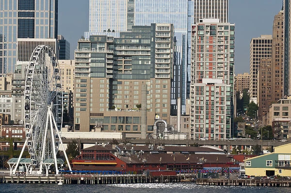 USA, WA, Seattle. Dramatic downtown waterfront with new Seattle Great Wheel on Pier 57