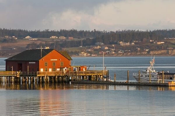 USA, WA, Whidbey Island, Coupeville. Wharf and whale watching boat at first light