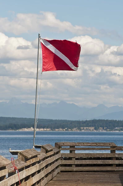 USA, WA, Whidbey Island. Dive flag on Langley marina pier fully extended