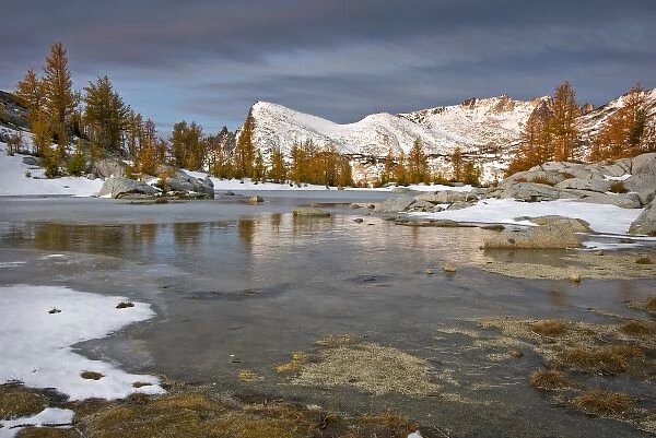 USA, Washington, Cascade Mountains. Little Annapurna from a frozen tarn in the Enchantment Lakes