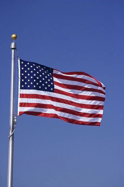 USA, Washington, D. C. One of the 50 American flags at the Washington Monument. Credit as