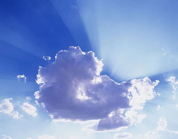 USA, Washington. God rays stream from behind cloud