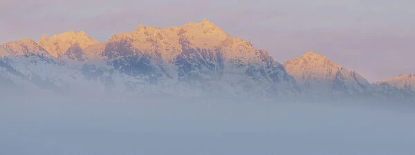 USA, Washington, Mount Constance. Foggy sunrise panorama of mountain