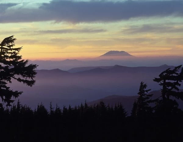 USA, Washington. Mount St. Helens seen through fog layers at sunset as viewed from Mt
