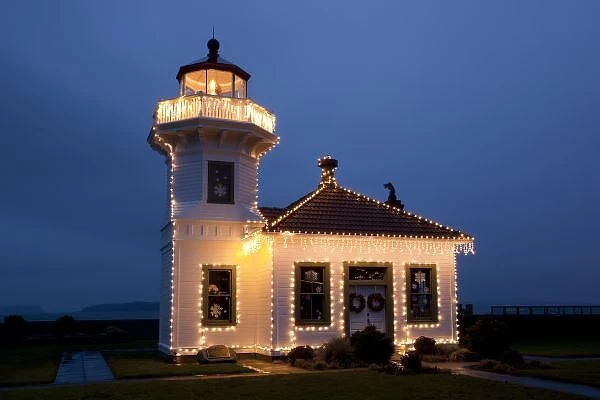 USA, Washington, Mukilteo. Mukilteo Lighthouse with holiday lights. Constructed in 1906
