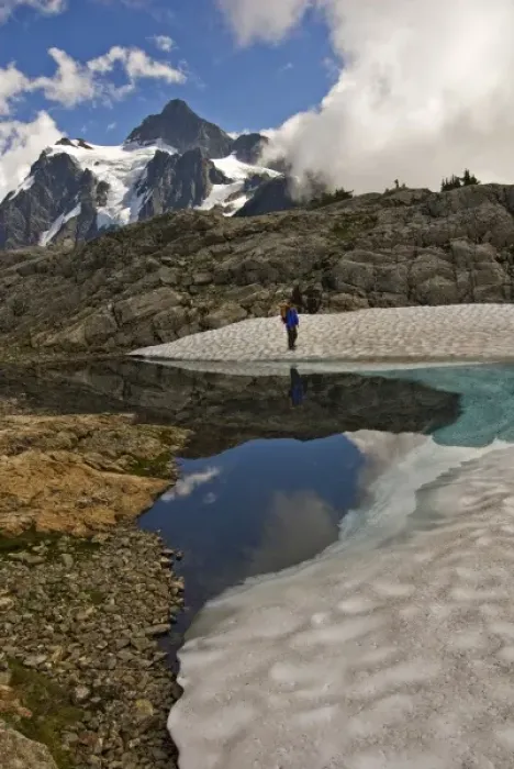 Framed Print : USA, Washington, North Cascades. A female hiker near Mt. Shuksan and the Mt. Baker Ski Area