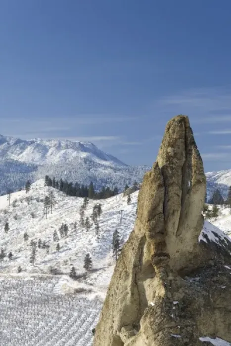 Framed Print : USA, Washington, Peshastin Pinnacles State Park. Jutting rock towers above wintry orchard