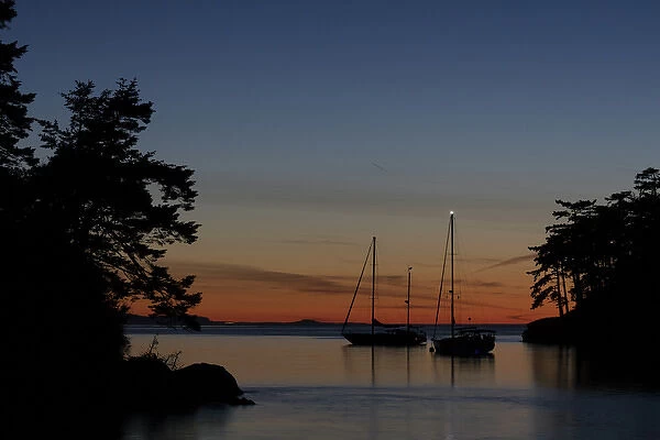 USA, Washington, San Juan Islands. Sailboats in Active Cove at sunset. Credit as