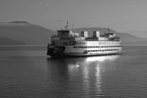USA, Washington, San Juan Islands. A ferry glides across the water in front of Orcas