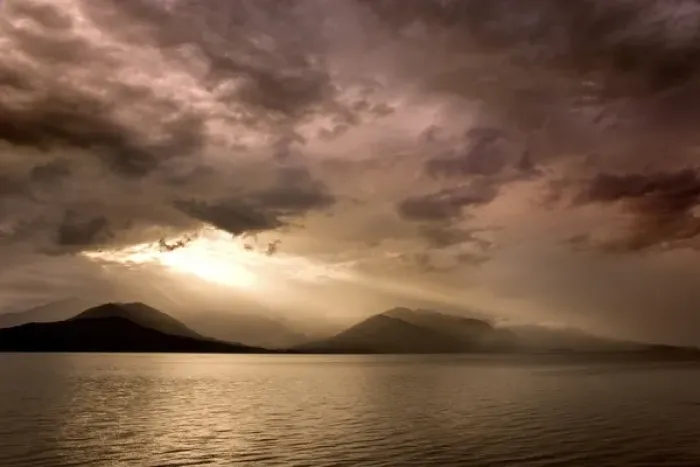 Framed Print : USA, Washington, Seabeck. God rays shine through dark clouds over Hood Canal. Credit as