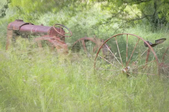 Framed Print : USA, Washington, Seabeck. Rusty old tractor in grasses waving in breeze. Credit as