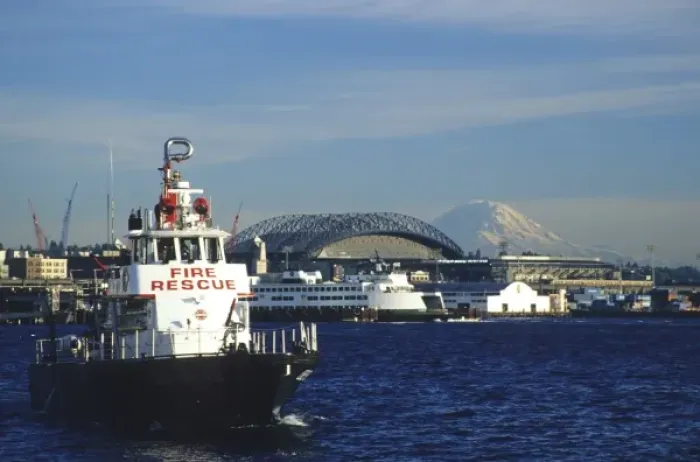 Framed Print : USA, Washington, Seattle, Elliott Bay. Fire rescue boat in Elliott Bay with Safeco Field and Mt Framed Print : USA, Washington, Seattle, Elliott Bay. Fire rescue boat in Elliott Bay with Safeco Field and Mt