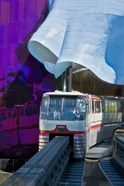 USA, Washington, Seattle. Monorail arrives at Seattle Center station passing through