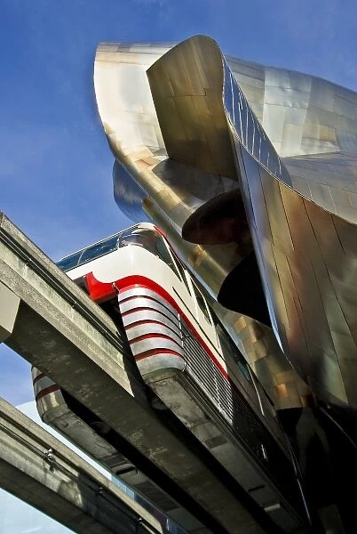 USA, Washington, Seattle. Monorail emerges from Experience Music Project building