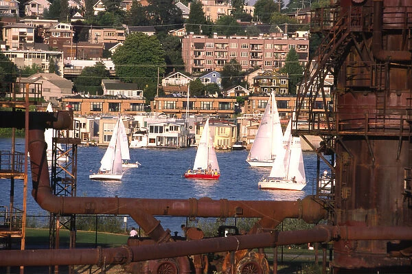 USA, Washington, Seattle. Sailboats on Lake Union pass rusty gas conversion relics