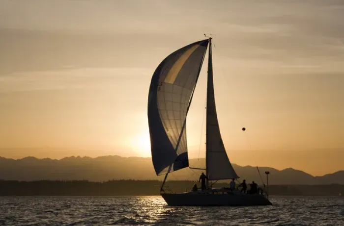 Framed Print : USA, Washington, Seattle, Setting sun lights yacht sailing in Elliot Bay on spring