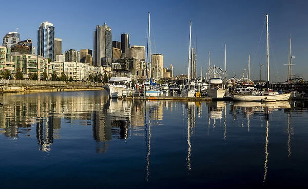 USA, Washington, Seattle. Waterfront and skyline viewed over boats in the Pier 66