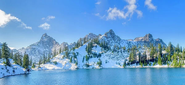 USA, Washington State, Alpine Lakes Wilderness. Panorama view of Gem Lake and Kaleetan Peak with snow