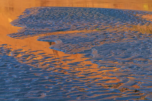 USA, Washington State, Copalis Beach. Patterns in beach sand at sunset