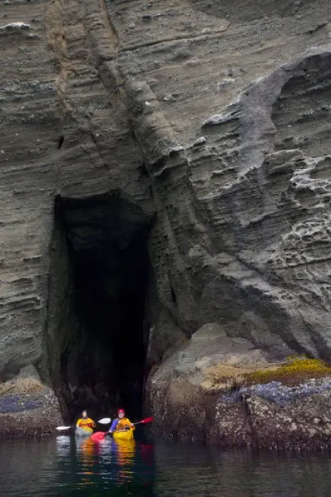 Framed Print : USA. Washington state. Man and woman sea kayakers explore a sea cave at Cape Flattery Framed Print : USA. Washington state. Man and woman sea kayakers explore a sea cave at Cape Flattery
