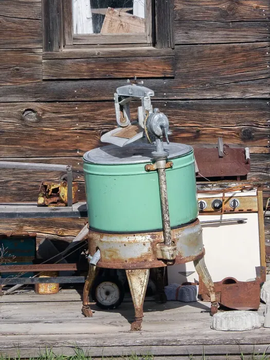 Framed Print : USA, Washington State, Molson, Okanogan County. An old washing machine and old rusty stove on the porch of a building in the historic ghost town
