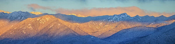 USA, Washington State. Panoramic of sunrise on Olympic Mountains in winter