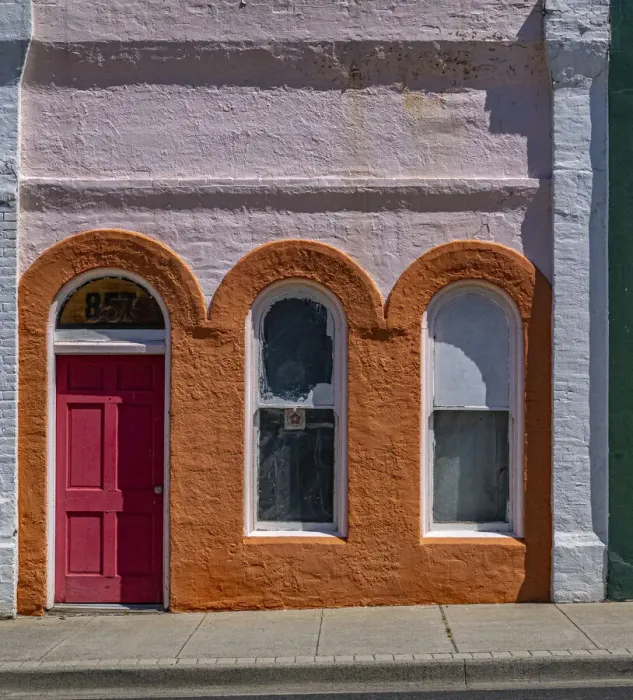 Framed Print : USA, Washington State, Pomeroy. Colorful old building with arched windows and doorway with scale Framed Print : USA, Washington State, Pomeroy. Colorful old building with arched windows and doorway with scale
