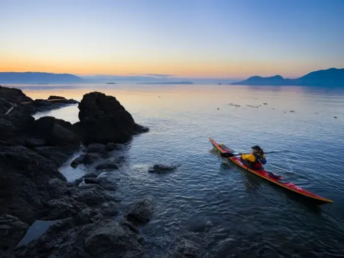 Framed Print : USA, Washington State, San Juan Islands, Doe Island. Woman sea kayaker paddling at dawn Framed Print : USA, Washington State, San Juan Islands, Doe Island. Woman sea kayaker paddling at dawn