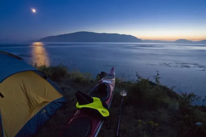 Framed Print : USA, Washington State, San Juan Islands, Strawberry Island. Kayak camp at dusk with moonlight Framed Print : USA, Washington State, San Juan Islands, Strawberry Island. Kayak camp at dusk with moonlight