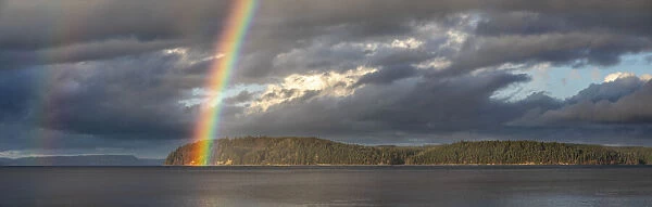 USA, Washington State, Seabeck. Panoramic of rainbow over Hood Canal