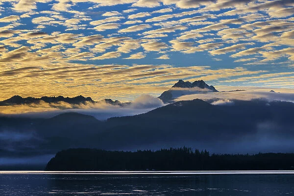 USA, Washington State, Seabeck. Sunset over Olympic Mountains and Hood Canal