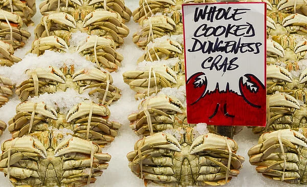 USA, Washington State, Seattle. Cooked Dungeness crab on ice display at Pike Place