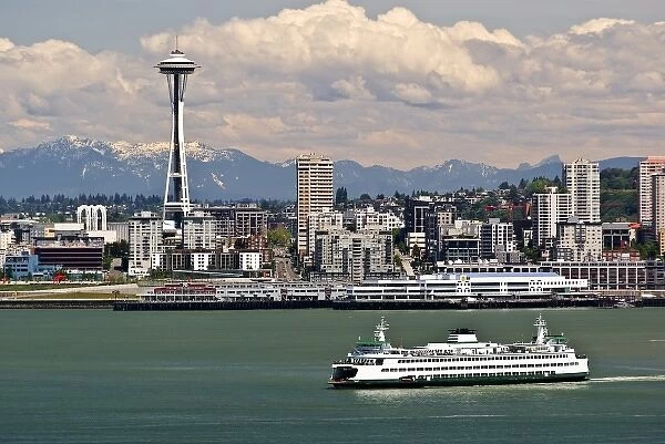 USA, Washington State, Seattle. Ferry crosses Elliot Bay under the Space Needle